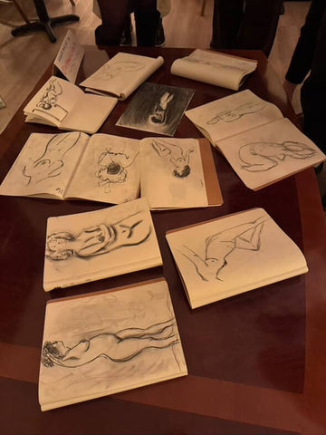 Figure drawing sketchbooks displayed on table from a life drawing session at Art Café SLC in Salt Lake City